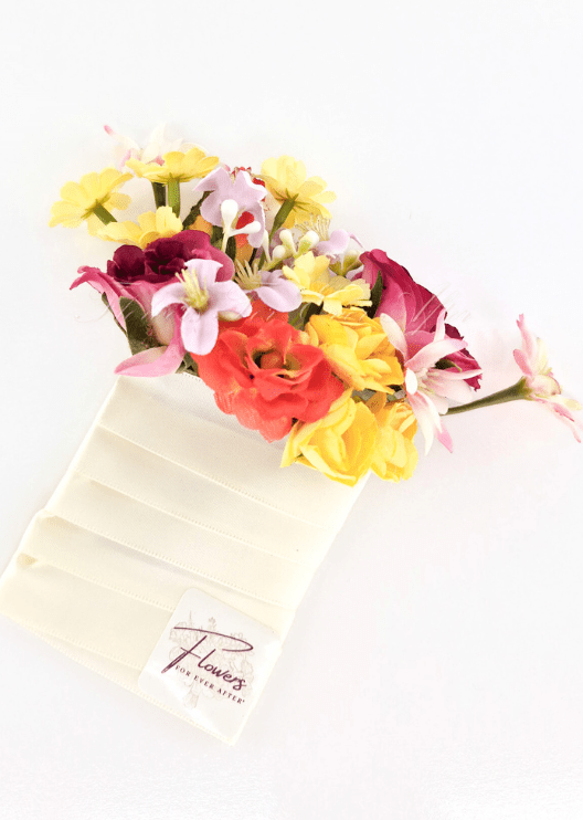 Artificial wedding pocket corsage with yellow, orange and magenta faux roses, pink blossoms and yellow daisies on an ivory fabric backing. For formals, proms and ball occasions. Made in Melbourne by Flowers For Ever After, shipping Australia and Worldwide.