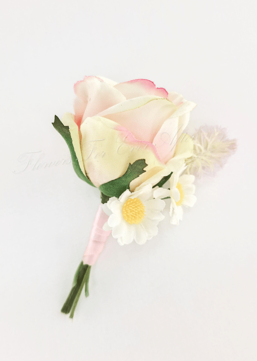 Artificial wedding boutonniere with a cream-and-pink faux rose, white daisies, a pale feathery sprig and pink-wrapped stem. For formals, proms and ball occasions. Made in Melbourne by Flowers For Ever After, shipping Australia and Worldwide.