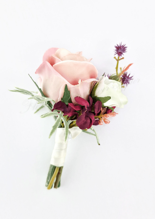 Artificial wedding boutonniere with a blush faux rose, smaller white rosebud, burgundy flowers, purple sprigs and white-wrapped stems. For formals, proms and ball occasions. Made in Melbourne by Flowers For Ever After, shipping Australia and Worldwide.
