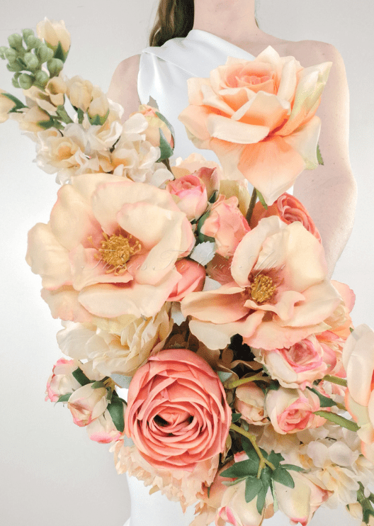 Artificial wedding bridesmaid bouquet, angled view of mixed faux blooms and green leaves. Made in Melbourne by Flowers For Ever After, shipping Australia and Worldwide.