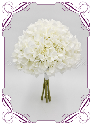 Artificial Bridal flowers in white hydrangea. Silk wedding Bouquet posy, featuring faux flowers in a romantic elegant and unusual bridal style, classic white and traditional wedding bouquets. Made in Melbourne by Australia's Best Artificial Bridal Florist. Buy now Online. Worldwide Shipping available