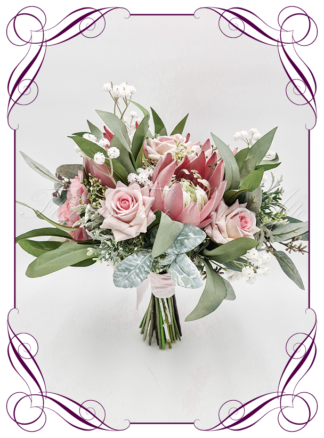 Artificial Bridal flowers in pink roses, native australian gum foliage, baby's breath and pink protea. Silk wedding Bouquet posy, featuring faux native flowers in a romantic elegant and unusual bridal style, classic white and traditional wedding bouquets. Made in Melbourne by Australia's Best Artificial Bridal Florist. Buy now Online. Worldwide Shipping available
